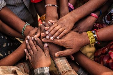 Children's hands in one of Indian villages showing unity.